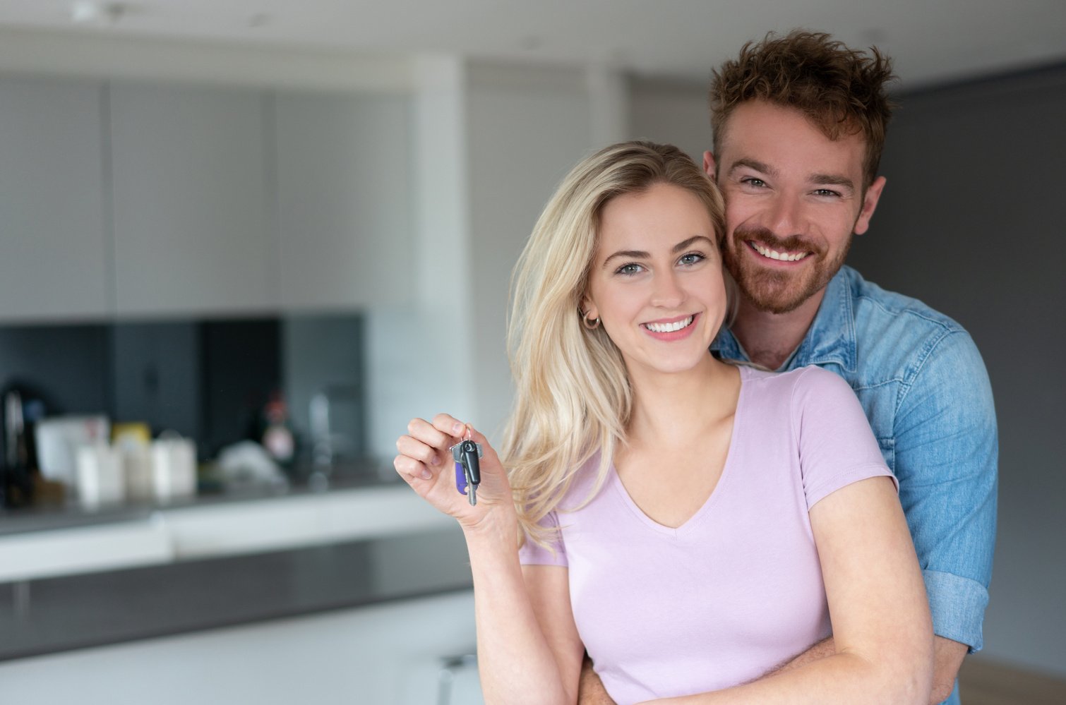 Happy couple buying a house